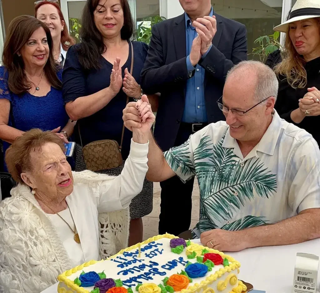 Malka “Mollie” Horwitz celebrating her birthday with Dan Gelber