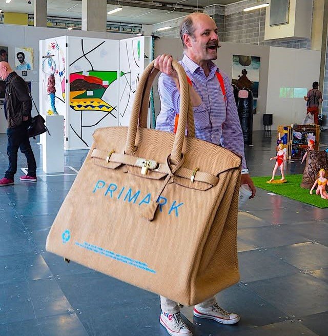 Artist Vinay Hathi created an oversized Sainsbury's "Birkin" bag from leftover carpet as a joke