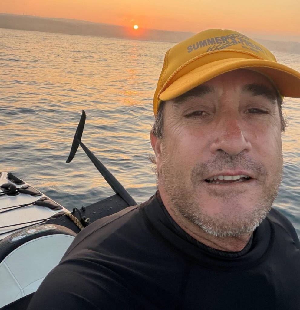 Surfer Matt Reynolds filmed a huge hammerhead shark lurking directly beneath him