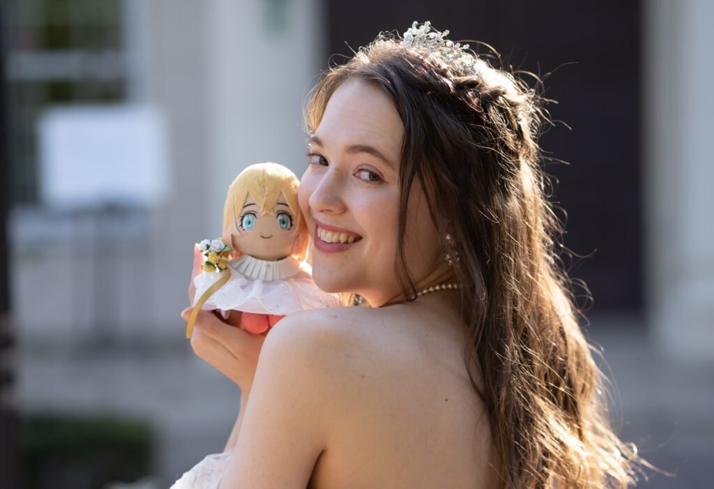 Lucie married anime character Mami in a 2D wedding and spent $2,000 on merch she takes everywhere