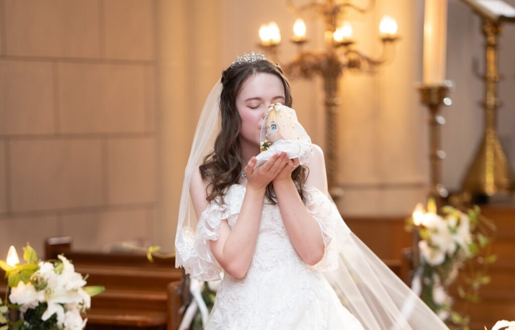 Lucie married anime character Mami in a 2D wedding and spent $2,000 on merch she takes everywhere