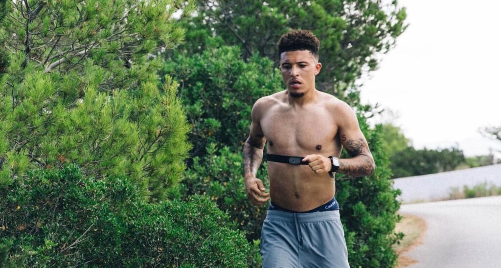 Jadon Sancho poses for photos in an Algarve football shop weeks before the Premier League opener