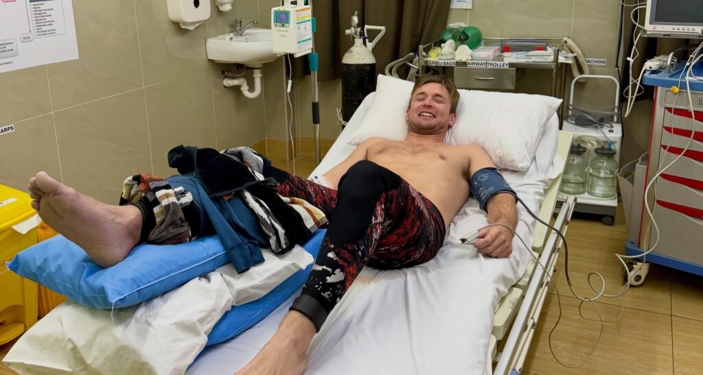 Fishing creator Henry Gibbs needed four surgeries and a skin graft after a grey reef shark attack in Fiji