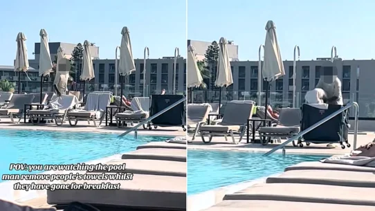 A hotel worker in Rhodes clears towels off reserved sunbeds