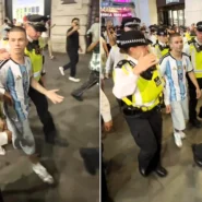 England fans surrounded a lone Argentina supporter in Piccadilly Circus after semi-final heartbreak, forcing Met Police to step in