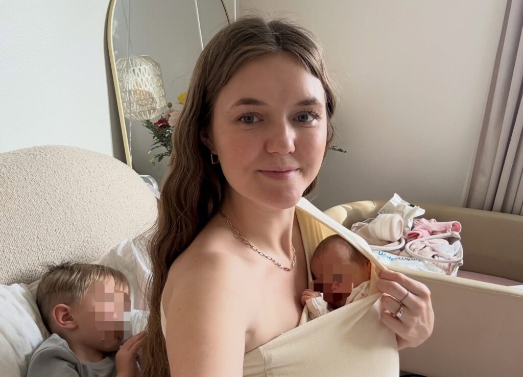 Angela Holm's five-month-old got restless at the gym, so the mum-of-five strapped her on and kept walking
