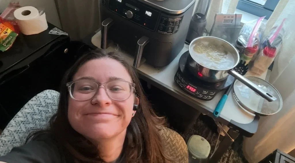 Lilli Holland has lived in hotels since June 2025 with her husband and two dogs. Free breakfast, weekly housekeeping, a pool, with someone else footing the bill.