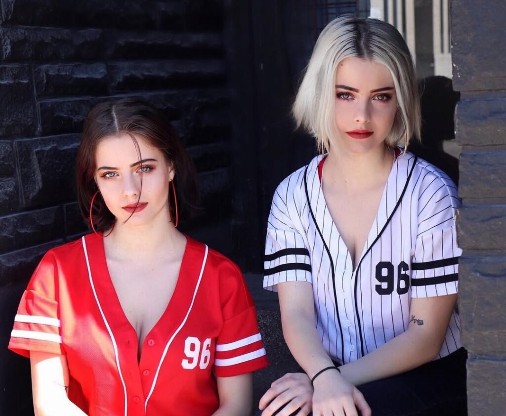 Julia (dark hair) and Lauren (blonde) Burch posing for a photo
