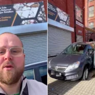 Luke Thurling speaking to camera beside his business; forklift lifting a silver car off the ground.